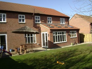 House extension to the rear with sky lights in the vaulted roof.